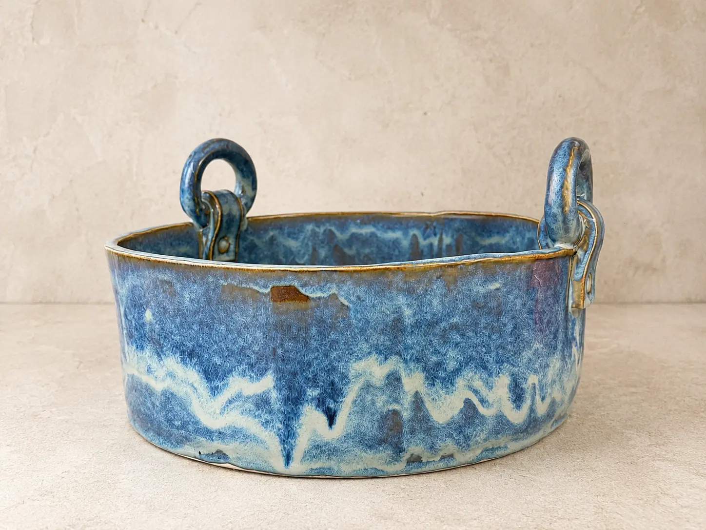 Blue drip-glazed stoneware baking dish with two ring handles